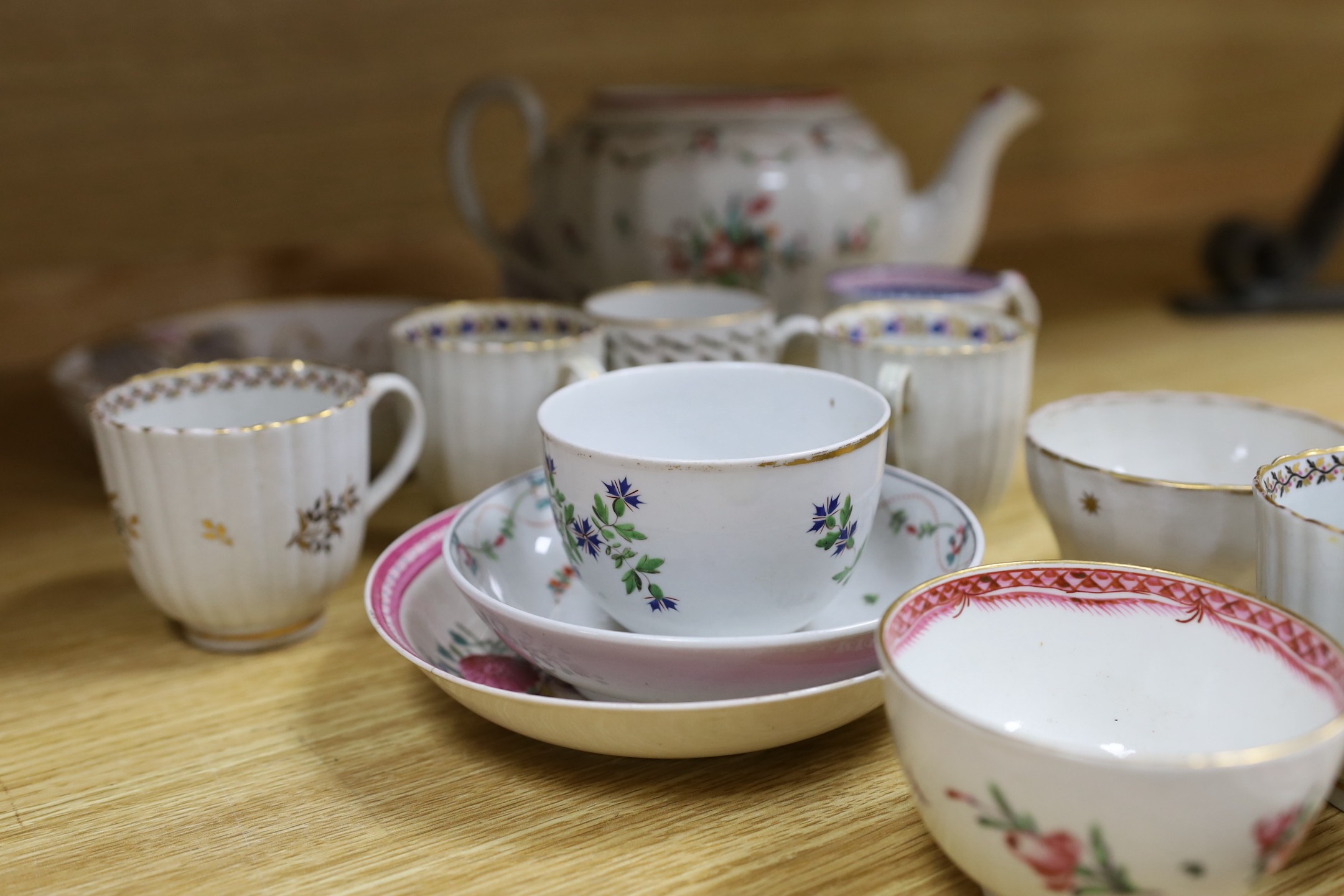 A Newhall saucer dish painted with pattern 85, octagonal Newhall-type spoon tray, clip-handled coffee cup painted with flowers, two ridge handled coffee cups, New Hall pattern 430 coffee cup, Newhall teapot and eight oth